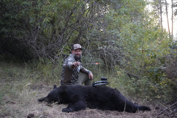 Shan Mowery with Black Bear harvested with Bear Archery compound bow